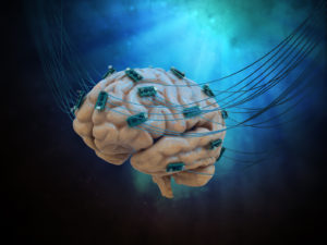 Human brain connected to cables and computer chips