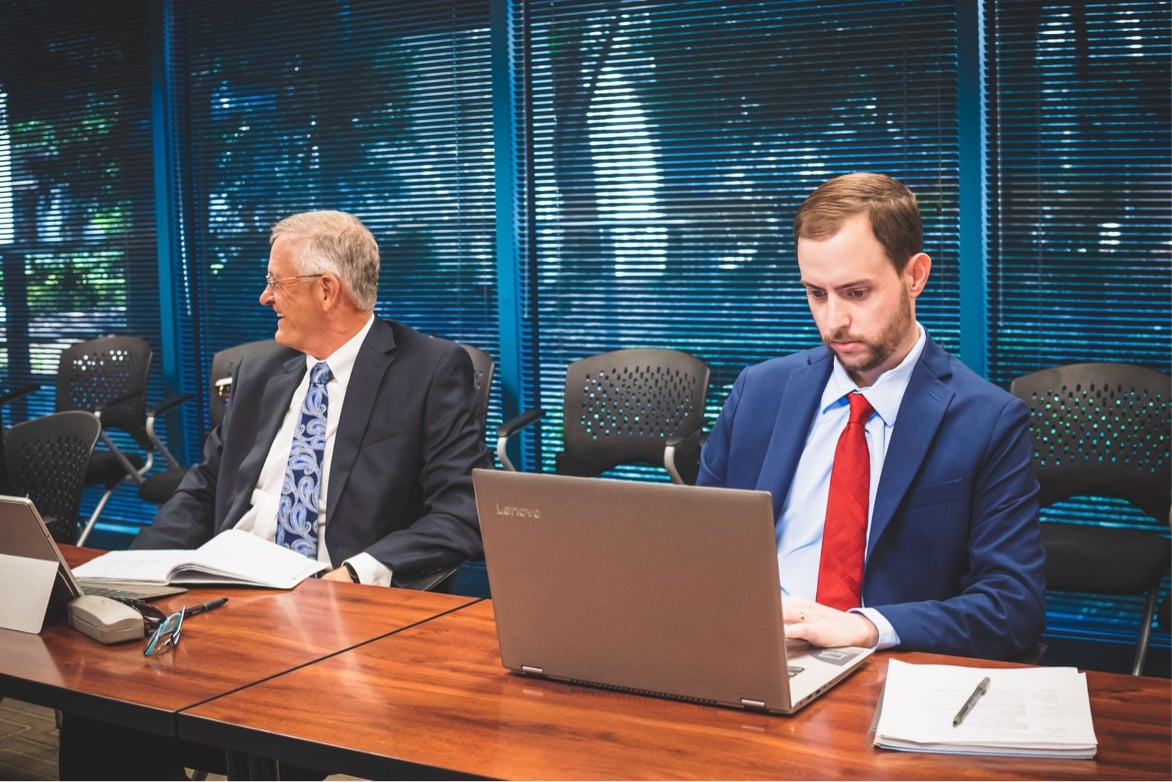 Businessmen working on laptop